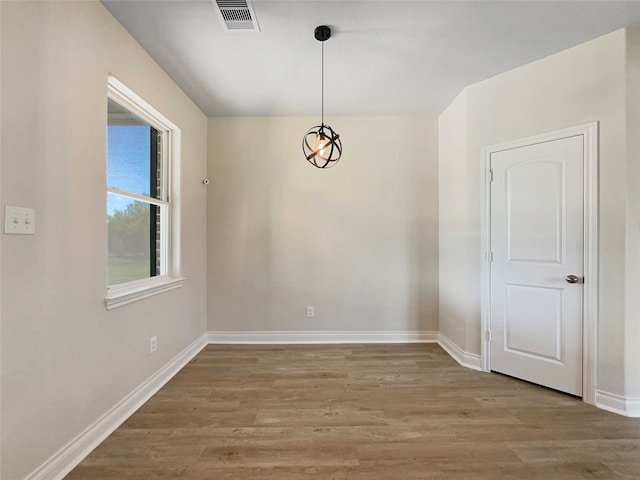 spare room featuring hardwood / wood-style floors