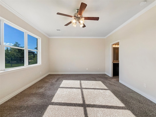 spare room featuring crown molding, carpet flooring, and ceiling fan