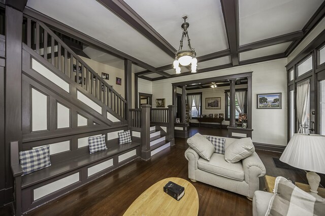 interior space featuring coffered ceiling, beam ceiling, ceiling fan, and dark wood-type flooring