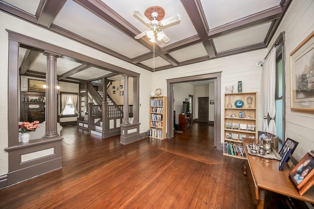 interior space featuring ceiling fan, beamed ceiling, coffered ceiling, decorative columns, and dark hardwood / wood-style flooring