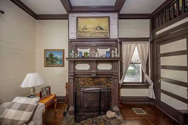 living area featuring a brick fireplace, wood walls, and dark hardwood / wood-style flooring