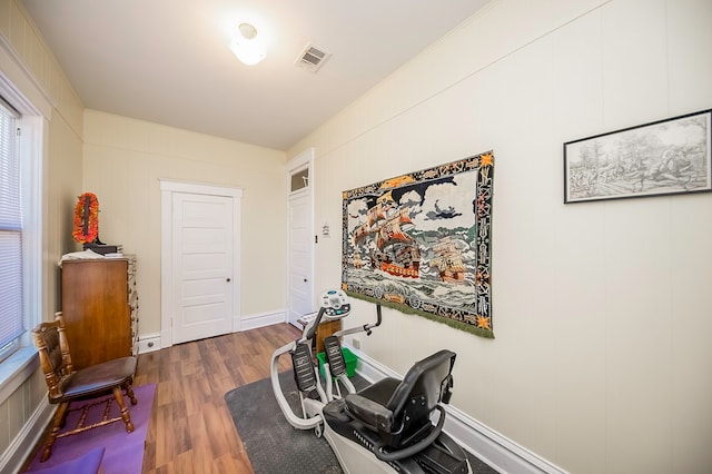 workout area with dark hardwood / wood-style flooring