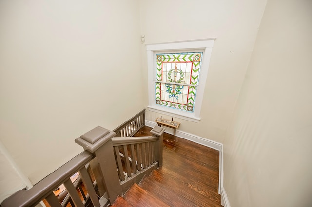 staircase featuring hardwood / wood-style floors