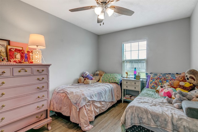 bedroom featuring ceiling fan and hardwood / wood-style flooring