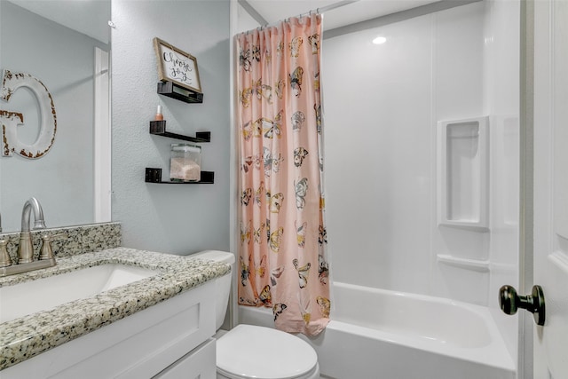 full bathroom featuring toilet, shower / bath combo, and vanity