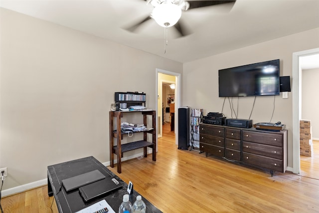 interior space featuring light wood-type flooring and ceiling fan