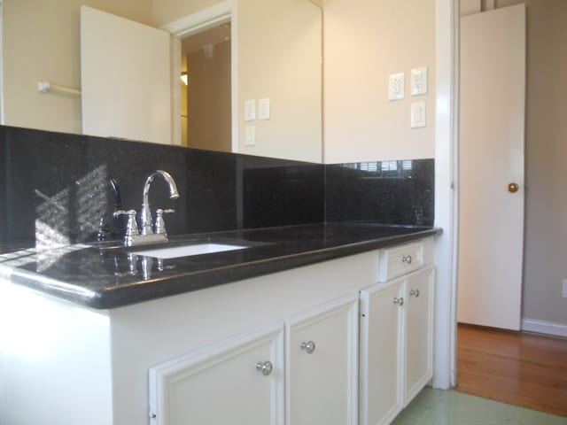 interior space featuring hardwood / wood-style floors and vanity