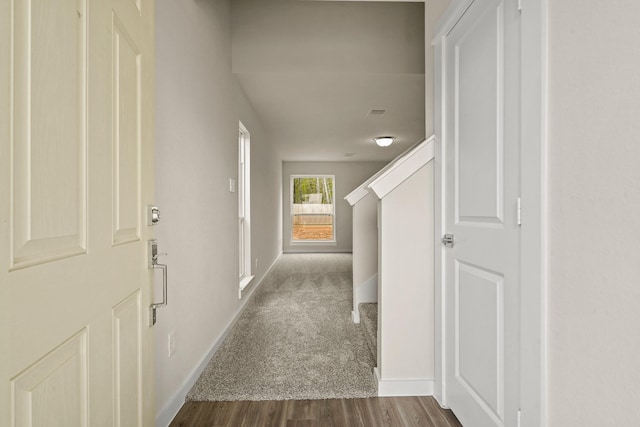 hallway with dark wood-type flooring