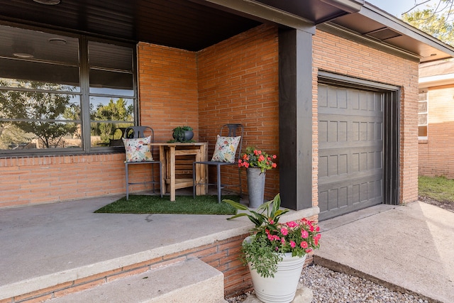 view of exterior entry featuring a garage