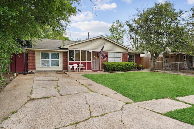 ranch-style home with a front yard