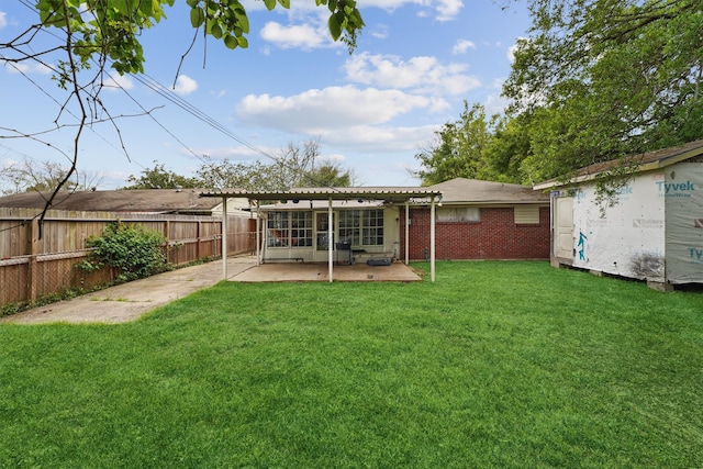 back of property featuring a lawn and a patio