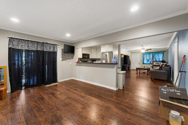 interior space with crown molding, dark hardwood / wood-style floors, a textured ceiling, and ceiling fan