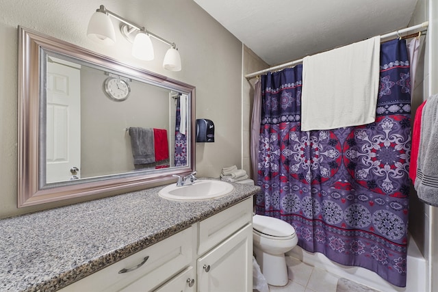 full bathroom with tile flooring, shower / bath combination with curtain, toilet, and vanity with extensive cabinet space