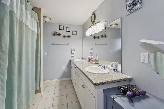 bathroom with tile flooring and dual vanity