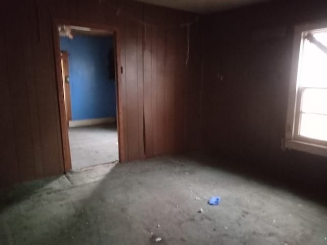 empty room with wood walls