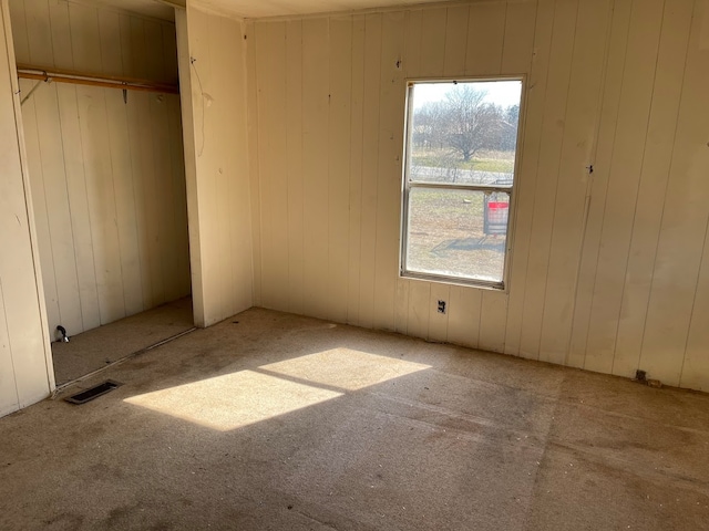 unfurnished bedroom featuring carpet floors and a closet