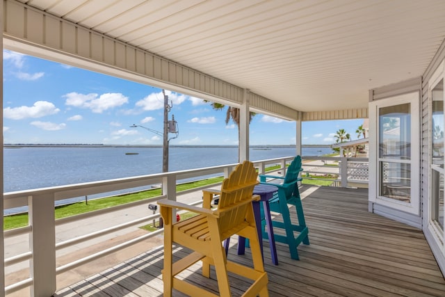 wooden terrace with a water view