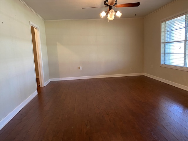 empty room with crown molding, dark hardwood / wood-style floors, and ceiling fan