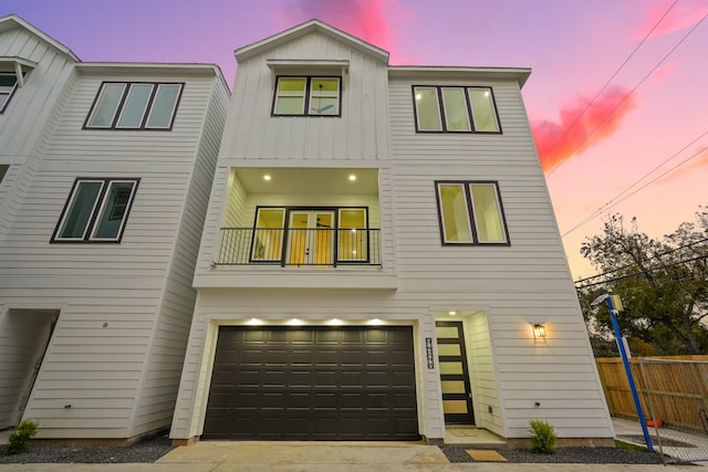 view of front of property with a balcony and a garage