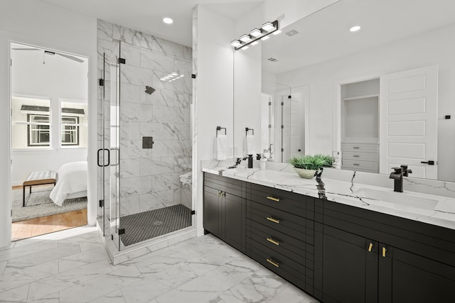 bathroom with a shower with shower door, tile flooring, dual vanity, and ceiling fan