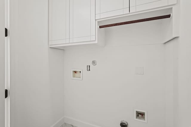 washroom with cabinets, hookup for a gas dryer, and hookup for a washing machine