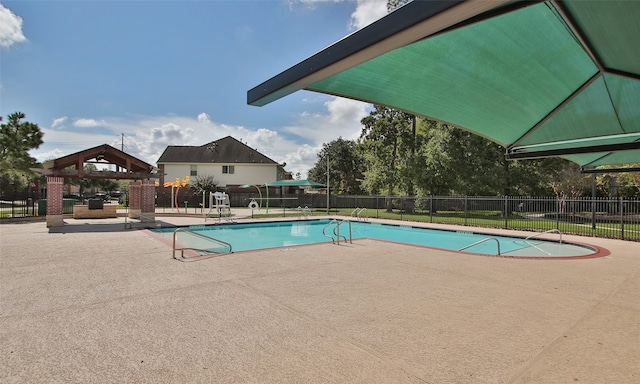 view of swimming pool featuring a patio area