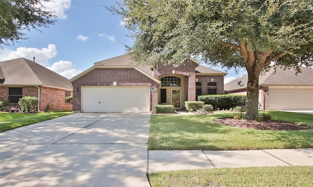 view of front of home featuring a garage and a front lawn