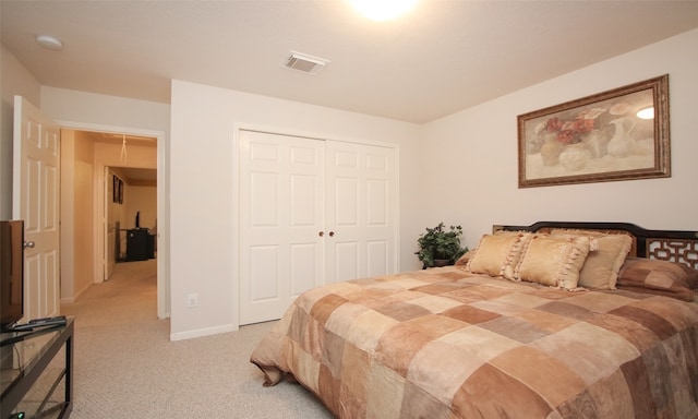 carpeted bedroom featuring a closet