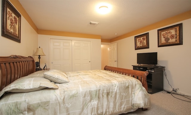 carpeted bedroom featuring a closet