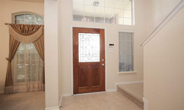 foyer entrance with light tile patterned flooring