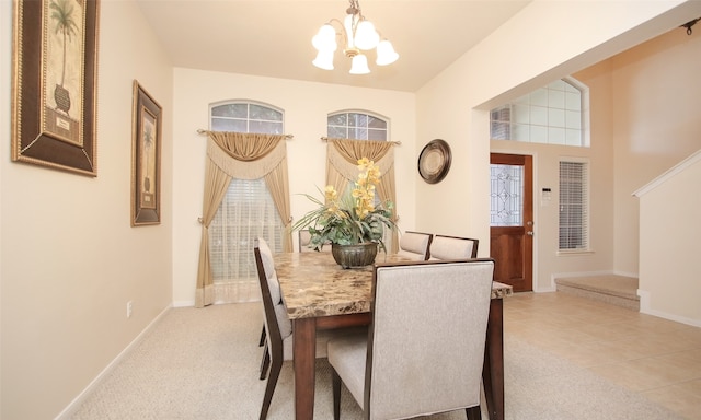 carpeted dining space with a notable chandelier