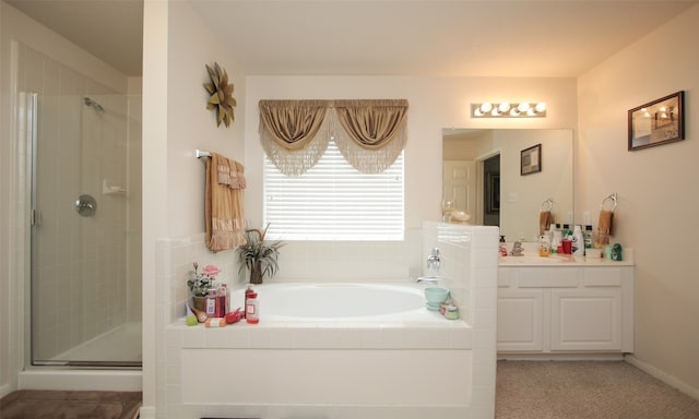 bathroom featuring vanity and plus walk in shower