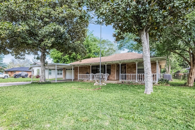 ranch-style house with covered porch and a front yard