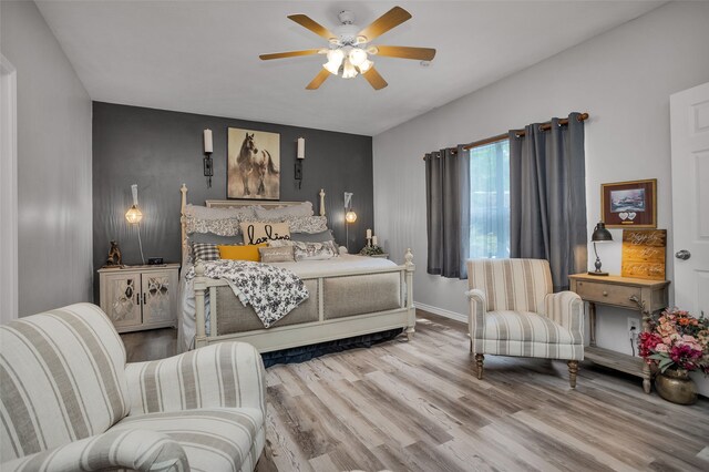 bedroom featuring ceiling fan and light wood-type flooring