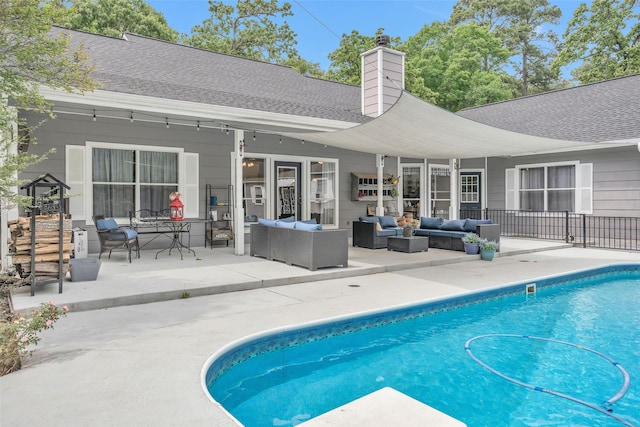 view of pool featuring a patio and an outdoor living space