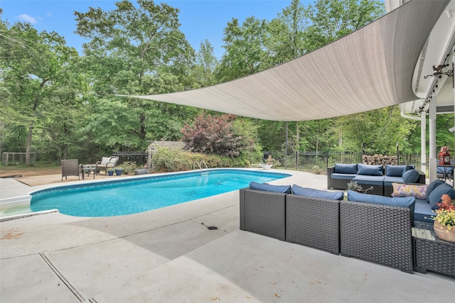 view of swimming pool featuring a patio and an outdoor living space