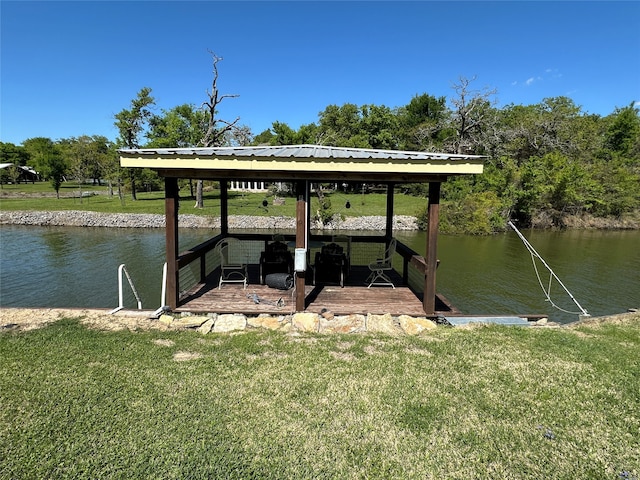 view of dock with a water view and a yard