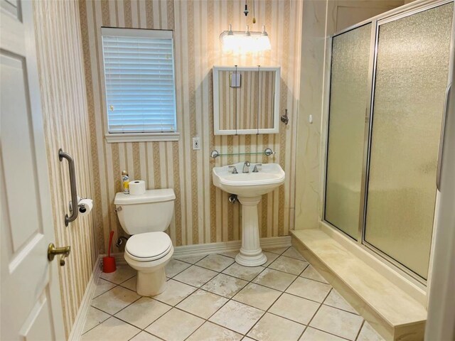 204 W Fayette St, Fayetteville, TX 78940 - bathroom featuring toilet, a shower with shower door, and tile patterned flooring