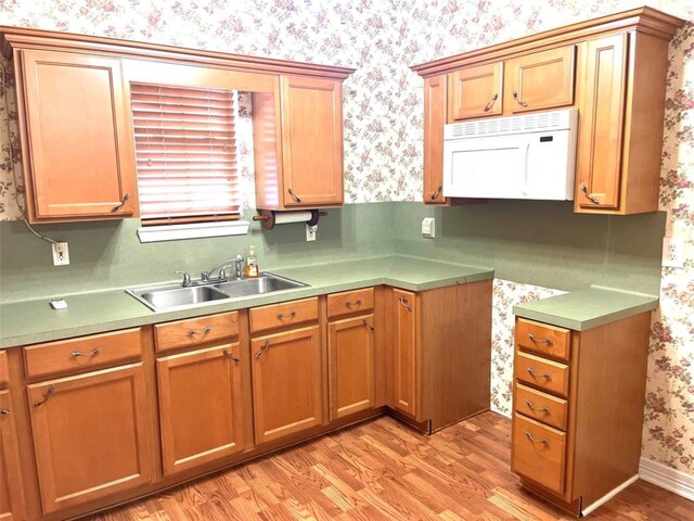 204 W Fayette St, Fayetteville, TX 78940 - kitchen with sink and light hardwood / wood-style floors