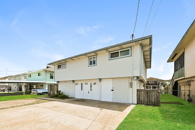 back of house with a yard