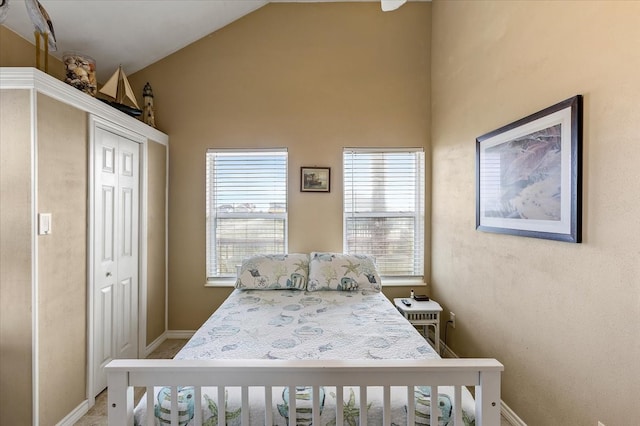 bedroom featuring vaulted ceiling and a closet