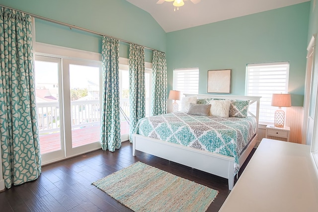 bedroom featuring access to exterior, ceiling fan, vaulted ceiling, and dark wood-type flooring