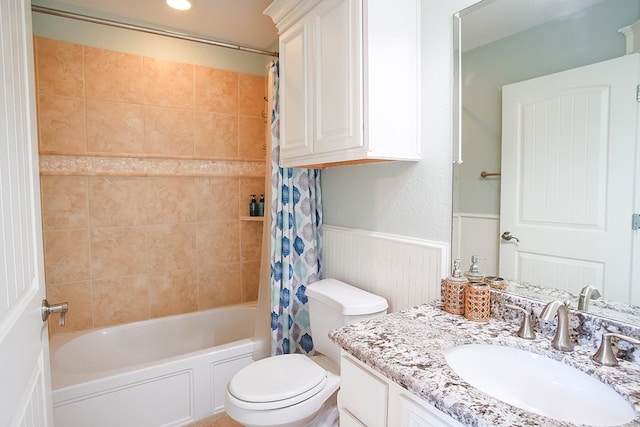 full bathroom with shower / bath combination with curtain, toilet, and vanity