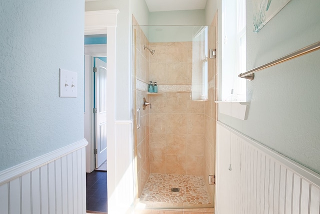 bathroom with tiled shower