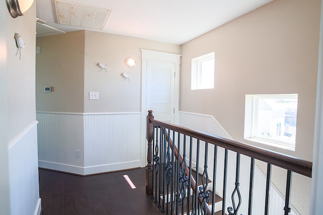 corridor with dark hardwood / wood-style flooring