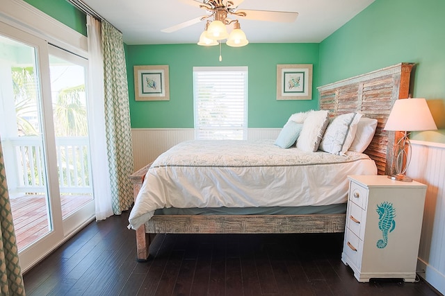 bedroom featuring ceiling fan, access to outside, and dark wood-type flooring