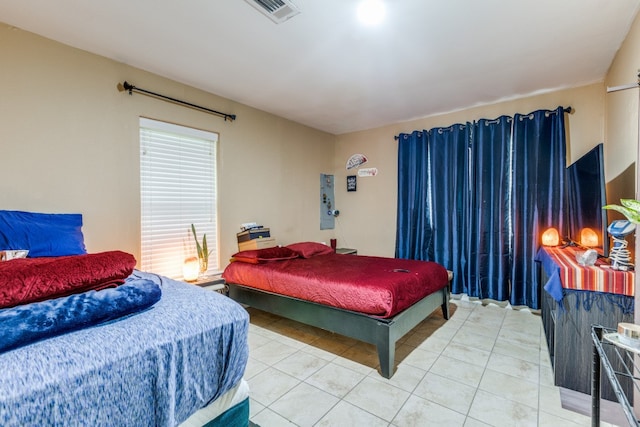 bedroom with light tile flooring