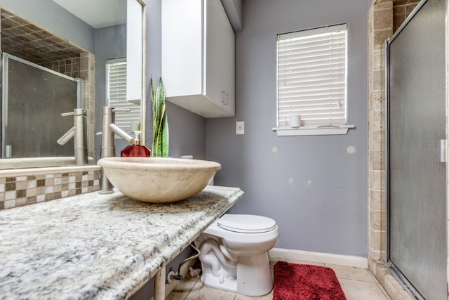 bathroom with toilet, tile flooring, an enclosed shower, and vanity