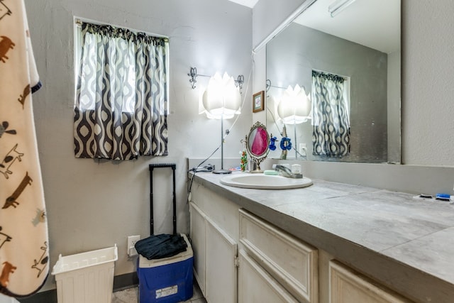 bathroom with vanity with extensive cabinet space