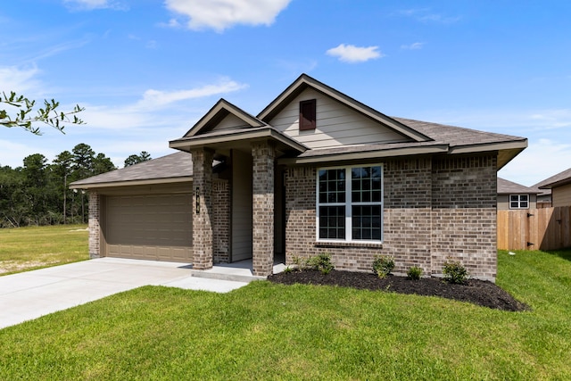 view of front of house with a garage and a front lawn